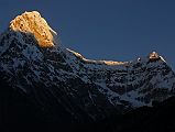 Rolwaling 06 01 Kang Nachugo At Sunrise From Kabug The summit area of the east face of Kang Nachugo (6735m) glistened at sunrise from Kabug.